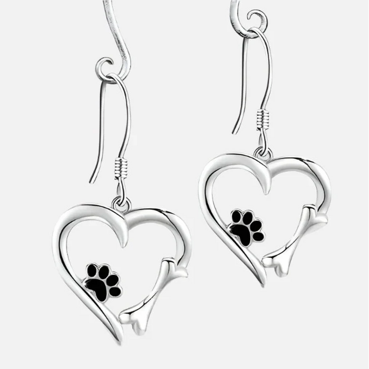 Silver dangling earrings with heart and paw print design